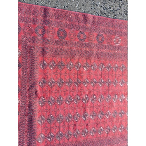 2118 - FINE HAND WOVEN RICH RED GROUND TURKMAN CARPET WITH ALL OVER BAKARA DESIGN 294CM X 191CM