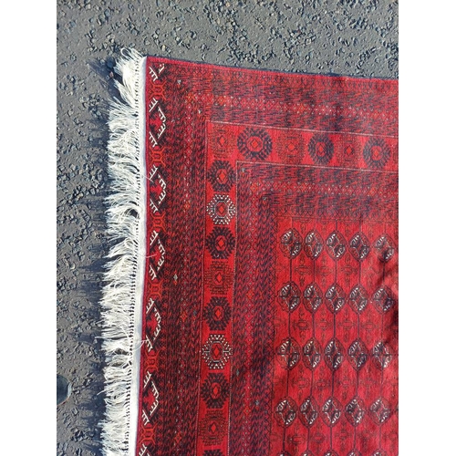 2118 - FINE HAND WOVEN RICH RED GROUND TURKMAN CARPET WITH ALL OVER BAKARA DESIGN 294CM X 191CM