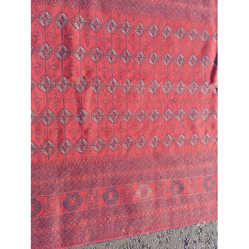 2118 - FINE HAND WOVEN RICH RED GROUND TURKMAN CARPET WITH ALL OVER BAKARA DESIGN 294CM X 191CM