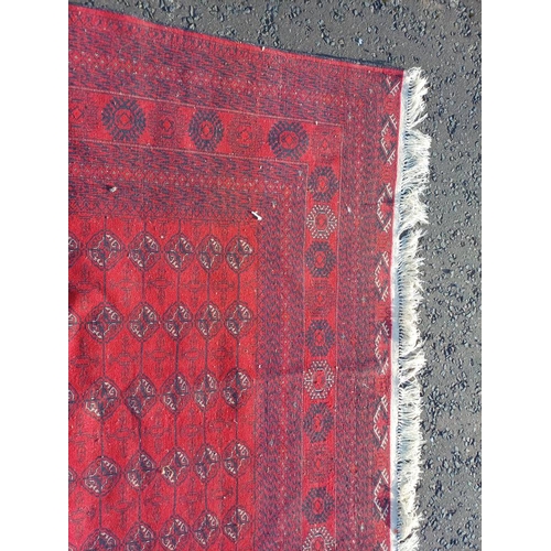 2118 - FINE HAND WOVEN RICH RED GROUND TURKMAN CARPET WITH ALL OVER BAKARA DESIGN 294CM X 191CM