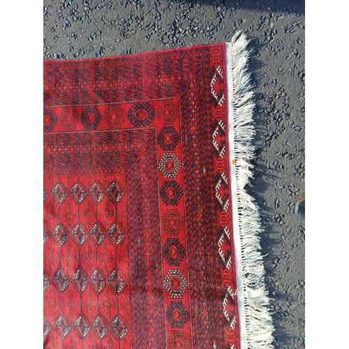 2118 - FINE HAND WOVEN RICH RED GROUND TURKMAN CARPET WITH ALL OVER BAKARA DESIGN 294CM X 191CM