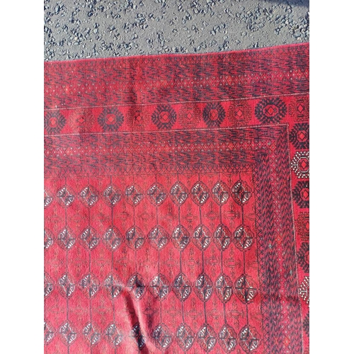 2118 - FINE HAND WOVEN RICH RED GROUND TURKMAN CARPET WITH ALL OVER BAKARA DESIGN 294CM X 191CM