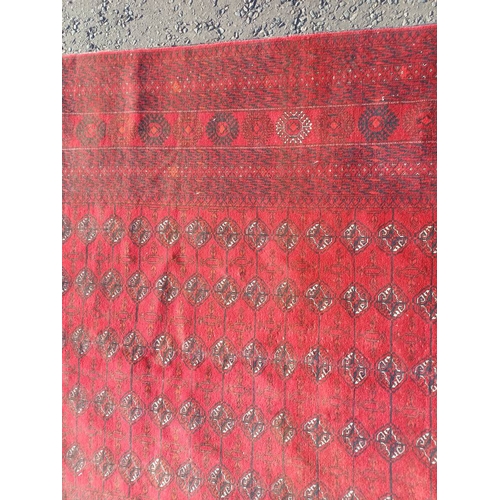 2118 - FINE HAND WOVEN RICH RED GROUND TURKMAN CARPET WITH ALL OVER BAKARA DESIGN 294CM X 191CM