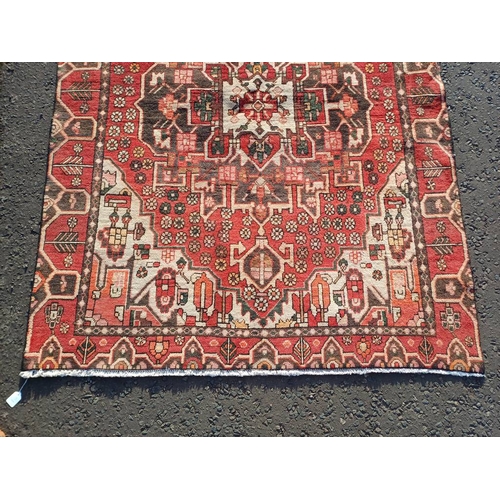 2130 - WASHED RED GROUND WOVEN PERSIAN HERIZ RUG WITH TRADITIONAL DESIGN  199CM X 159CM