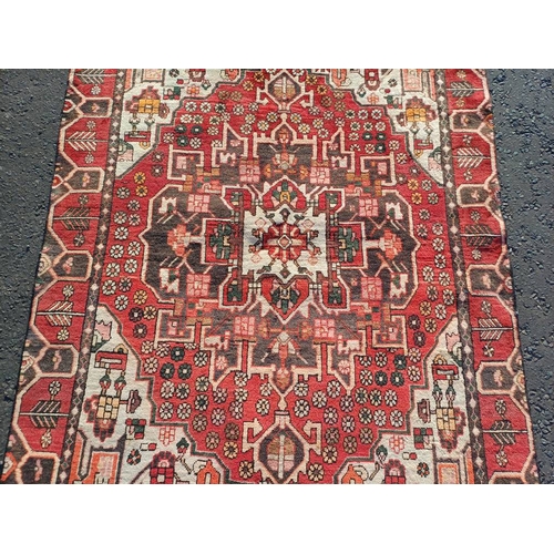 2130 - WASHED RED GROUND WOVEN PERSIAN HERIZ RUG WITH TRADITIONAL DESIGN  199CM X 159CM