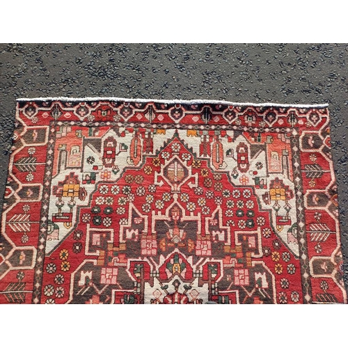 2130 - WASHED RED GROUND WOVEN PERSIAN HERIZ RUG WITH TRADITIONAL DESIGN  199CM X 159CM