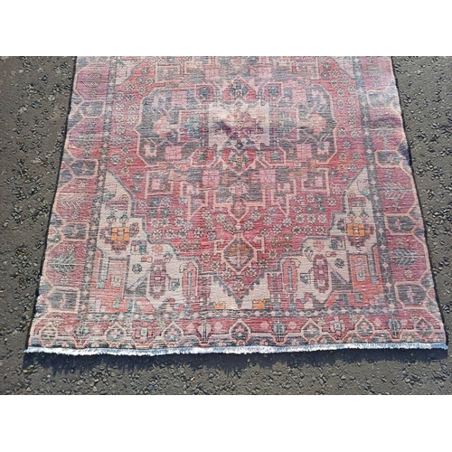 2130 - WASHED RED GROUND WOVEN PERSIAN HERIZ RUG WITH TRADITIONAL DESIGN  199CM X 159CM