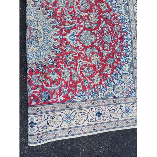 2133 - FINE HAND WOVEN PERSIAN NIAN CARPET WITH RED CENTRE WITH A IVORY SURROUND 289CM X 195CM