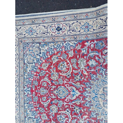 2133 - FINE HAND WOVEN PERSIAN NIAN CARPET WITH RED CENTRE WITH A IVORY SURROUND 289CM X 195CM