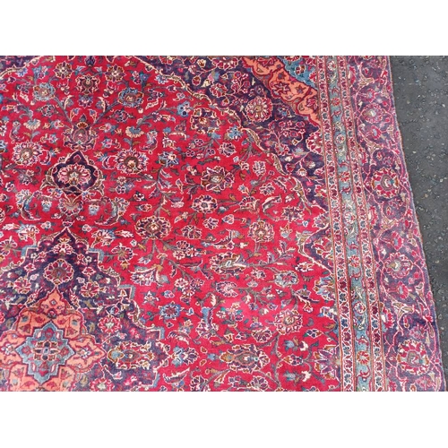 2145 - RED GROUND HAND WOVEN PERSIAN MASHED CARPET WITH FLORAL MEDALLION DESIGN 349CM X 262CM