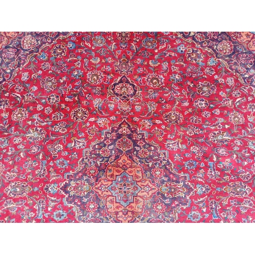 2145 - RED GROUND HAND WOVEN PERSIAN MASHED CARPET WITH FLORAL MEDALLION DESIGN 349CM X 262CM