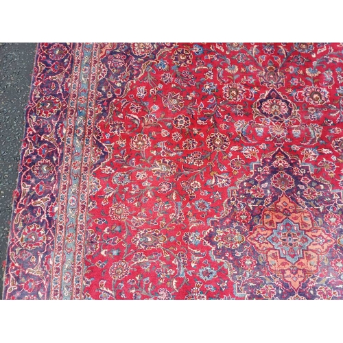 2145 - RED GROUND HAND WOVEN PERSIAN MASHED CARPET WITH FLORAL MEDALLION DESIGN 349CM X 262CM