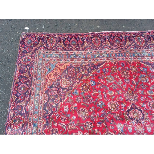 2145 - RED GROUND HAND WOVEN PERSIAN MASHED CARPET WITH FLORAL MEDALLION DESIGN 349CM X 262CM