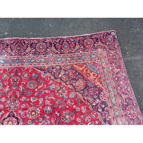 2145 - RED GROUND HAND WOVEN PERSIAN MASHED CARPET WITH FLORAL MEDALLION DESIGN 349CM X 262CM