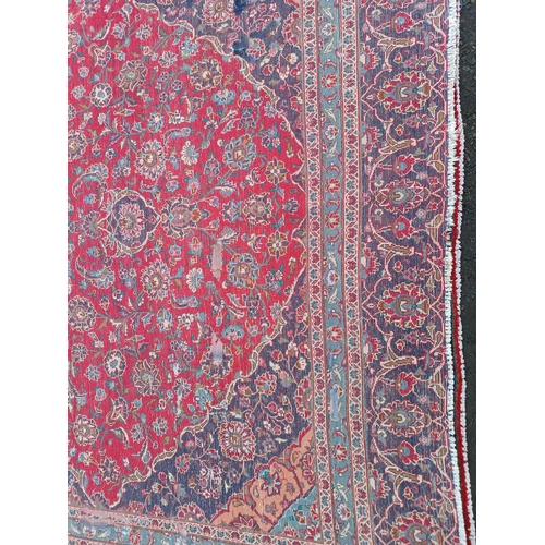 2145 - RED GROUND HAND WOVEN PERSIAN MASHED CARPET WITH FLORAL MEDALLION DESIGN 349CM X 262CM