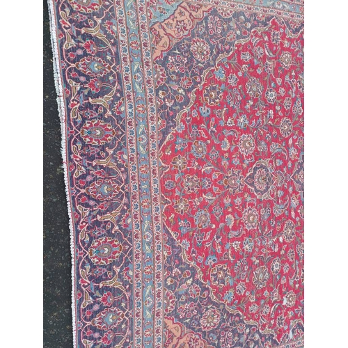 2145 - RED GROUND HAND WOVEN PERSIAN MASHED CARPET WITH FLORAL MEDALLION DESIGN 349CM X 262CM