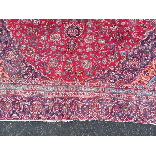 2145 - RED GROUND HAND WOVEN PERSIAN MASHED CARPET WITH FLORAL MEDALLION DESIGN 349CM X 262CM