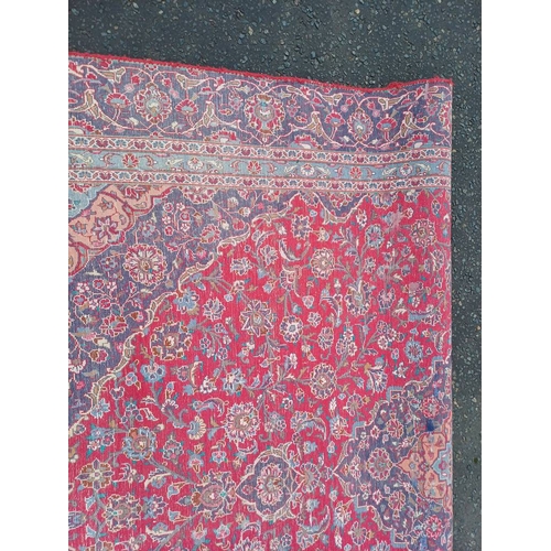 2145 - RED GROUND HAND WOVEN PERSIAN MASHED CARPET WITH FLORAL MEDALLION DESIGN 349CM X 262CM