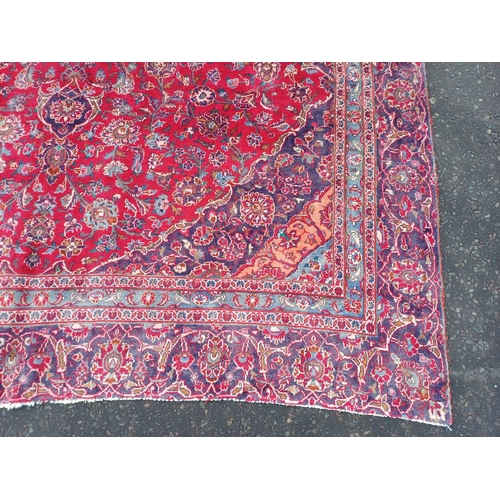 2145 - RED GROUND HAND WOVEN PERSIAN MASHED CARPET WITH FLORAL MEDALLION DESIGN 349CM X 262CM