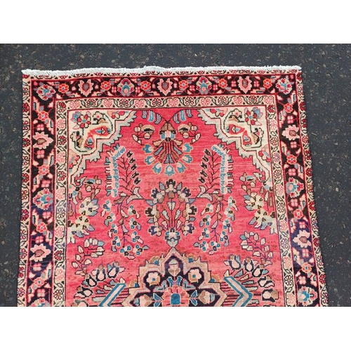 2178 - WASHED RED GROUND PERSIAN VILLAGE RUG WITH CENTRE MEDALLION DESIGN 189CM X 122CM