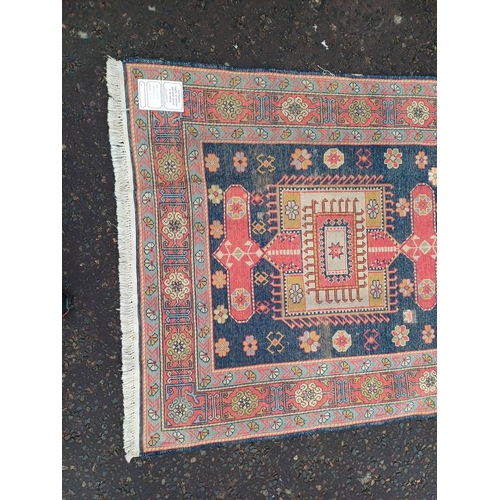 2190 - HAND WOVEN FULL PILE CAUCASIAN RUG, BLUE GROUND WITH A GEOMETRICAL MEDALLION DESIGN 201 X 120CM