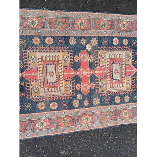 2190 - HAND WOVEN FULL PILE CAUCASIAN RUG, BLUE GROUND WITH A GEOMETRICAL MEDALLION DESIGN 201 X 120CM