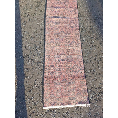 2076 - WASHED RED GROUND PERSIAN SUROK RUNNER WITH ALL OVER DESIGN 315CM X 58CM