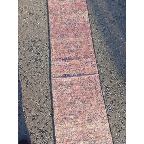 2076 - WASHED RED GROUND PERSIAN SUROK RUNNER WITH ALL OVER DESIGN 315CM X 58CM
