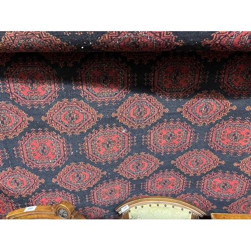 2091 - RED AND BLACK GROUND TURKMAN CARPET WITH ALL OVER DIAMOND BAKHAR DESIGN 390 X 253CM