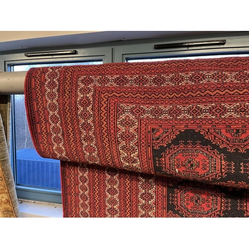 2091 - RED AND BLACK GROUND TURKMAN CARPET WITH ALL OVER DIAMOND BAKHAR DESIGN 390 X 253CM