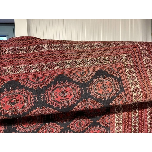 2091 - RED AND BLACK GROUND TURKMAN CARPET WITH ALL OVER DIAMOND BAKHAR DESIGN 390 X 253CM