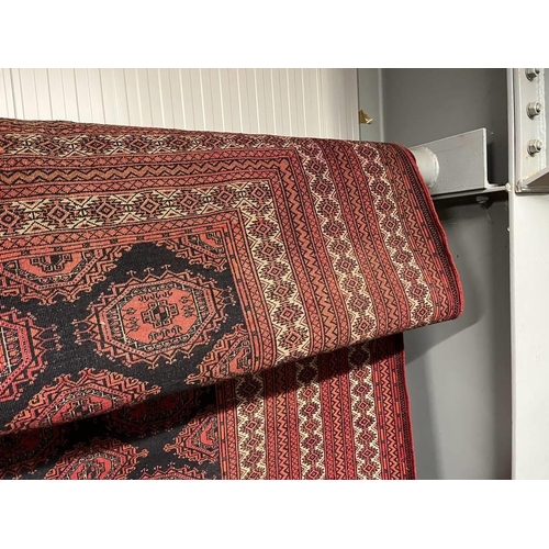 2091 - RED AND BLACK GROUND TURKMAN CARPET WITH ALL OVER DIAMOND BAKHAR DESIGN 390 X 253CM