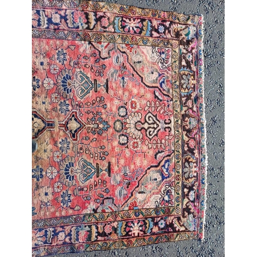 2112 - RED GROUND PERSIAN RUG WITH ALL OVER DESIGN 286 X 149CM