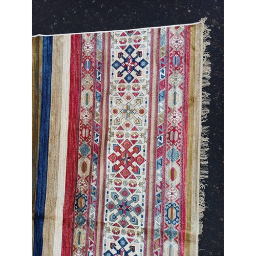 2139 - LARGE FULL PILE CASHMERE CARPET WITH MULTICOLOURED AZTEC DESIGN 383CM X 272CM