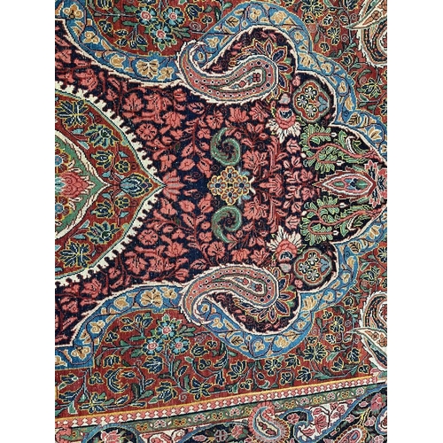 2312 - RED, PINK & GREEN FLORAL DECORATED RUG WITH BORDER DESIGN, 218 X 123 CM