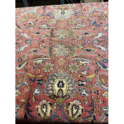 2321 - LARGE PINK & YELLOW GROUND MIDDLE EASTERN CARPET WITH ANIMAL, BIRD & FLORAL DESIGN, 390 X 300 CM