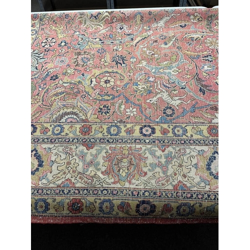 2321 - LARGE PINK & YELLOW GROUND MIDDLE EASTERN CARPET WITH ANIMAL, BIRD & FLORAL DESIGN, 390 X 300 CM