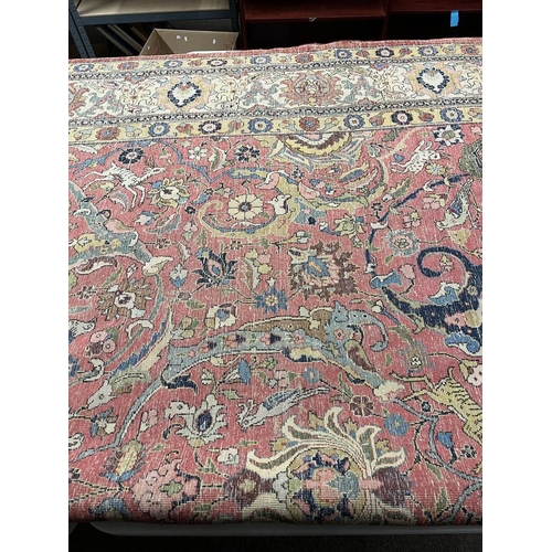 2321 - LARGE PINK & YELLOW GROUND MIDDLE EASTERN CARPET WITH ANIMAL, BIRD & FLORAL DESIGN, 390 X 300 CM