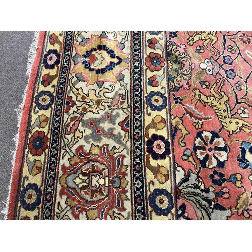 2321 - LARGE PINK & YELLOW GROUND MIDDLE EASTERN CARPET WITH ANIMAL, BIRD & FLORAL DESIGN, 390 X 300 CM