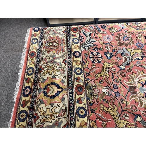 2321 - LARGE PINK & YELLOW GROUND MIDDLE EASTERN CARPET WITH ANIMAL, BIRD & FLORAL DESIGN, 390 X 300 CM