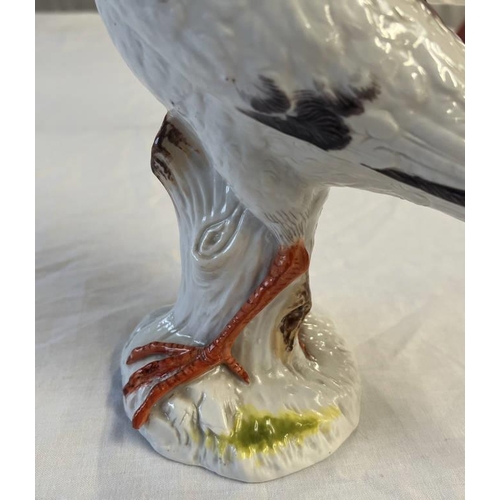 3058C - MEISSEN STYLE PORCELAIN FIGURE OF A BIRD WITH CROSSED SWORD MARK & 2083 TO BASE - 26 CM TALL