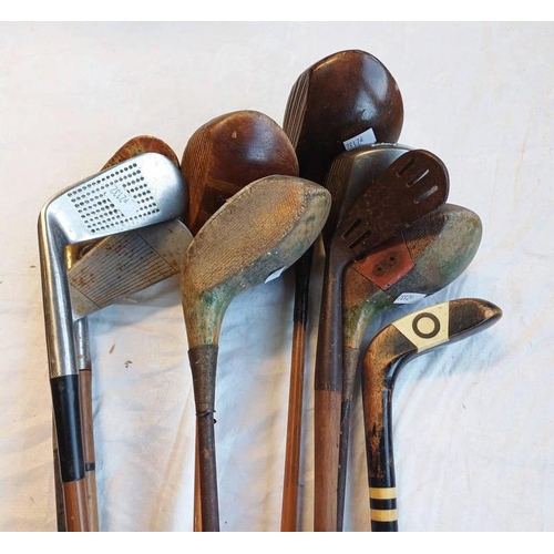 1235 - METAL SHAFTED GOLF CLUBS AND A WOODEN SUNDAY STICK