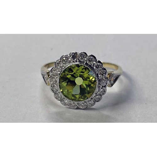 300 - 18CT GOLD PERIDOT & DIAMOND CLUSTER RING, THE CIRCULAR CUT PERIDOT SET WITHIN A SURROUND OF 18 DIAMO... 