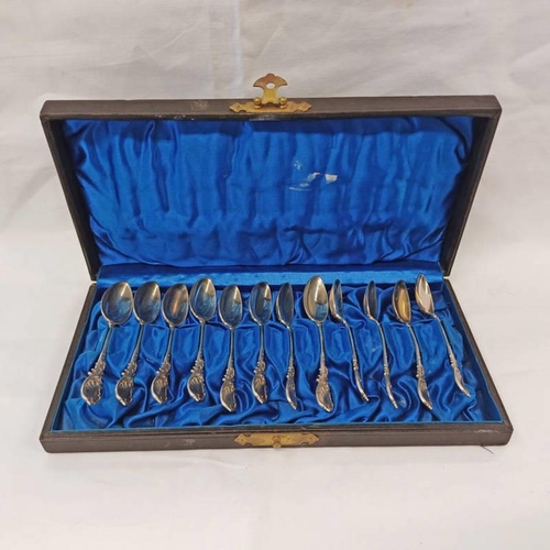 304 - CASED SET 12 WHITE METAL TEASPOONS WITH DECORATIVE HANDLES