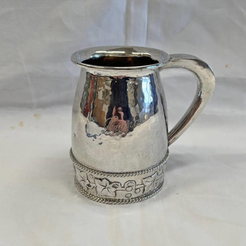 329 - SILVER CHRISTENING MUG WITH HAMMER EFFECT DECORATION & HOLLY LEAF BORDER BY A E JONES, BIRMINGHAM 19... 