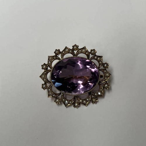 351 - EARLY 20TH CENTURY UNMARKED GOLD OVAL AMETHYST & SEED PEARL BROOCH.