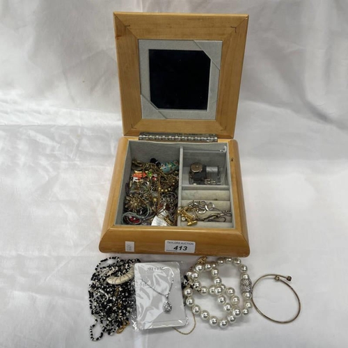 413 - MUSICAL JEWELLERY BOX & CONTENTS INCLUDING MICKEY MOUSE BROOCH, PASTE PEARL NECKLACE, ETC.