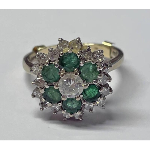 423 - 18CT GOLD EMERALD & DIAMOND CLUSTER RING, THE CENTRAL DIAMOND APPROX. 0.28 CARATS SET WITHIN A SURRO... 