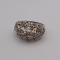 18CT WHITE GOLD DIAMOND SET FLORAL BOMBE RING BY STUART DEVLIN, LONDON ...