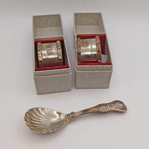 553 - PAIR OF SILVER CELTIC KNOT DECORATED NAPKIN RINGS, SILVER CADDY SPOON WITH SHELL BOWL, LONDON 1830 -... 